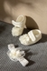 Комплект для дівчинки Mini Papi 100 Квіточка пінетки+пов'язка One Size Молочний (2000990058072D) Фото 1 з 7